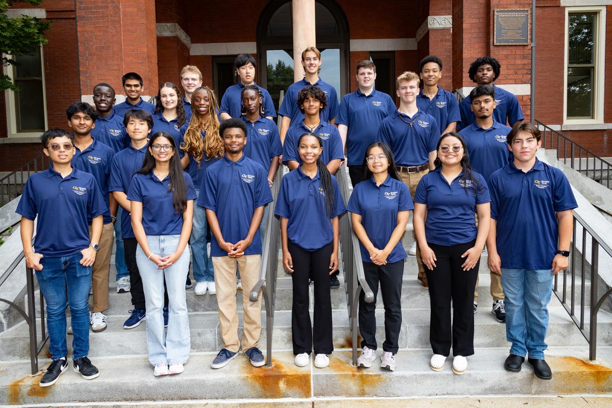 The 2024 Dean's Scholars standing on the front steps of Tech Tower.